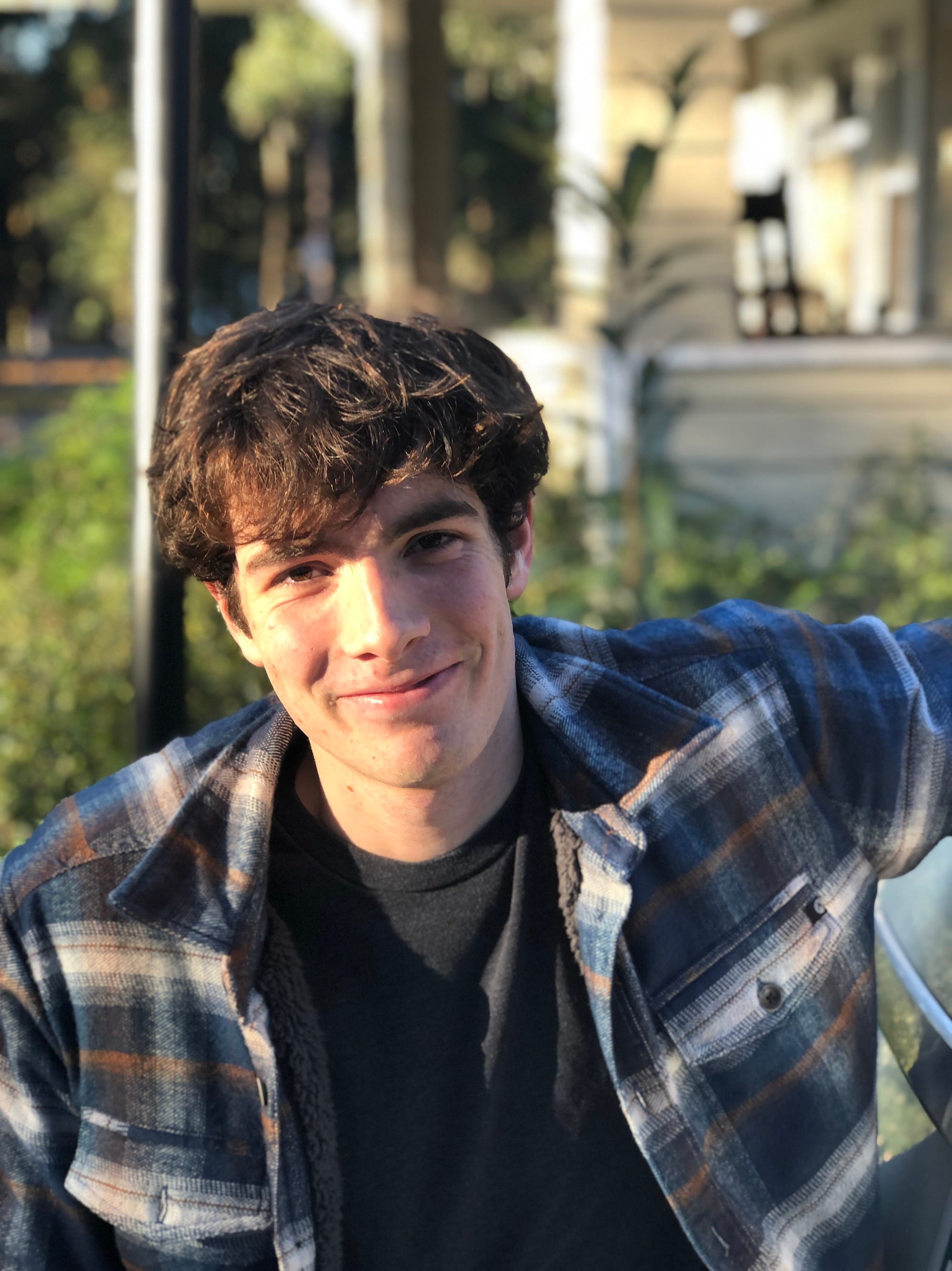 A photo of a man with brown hair.
