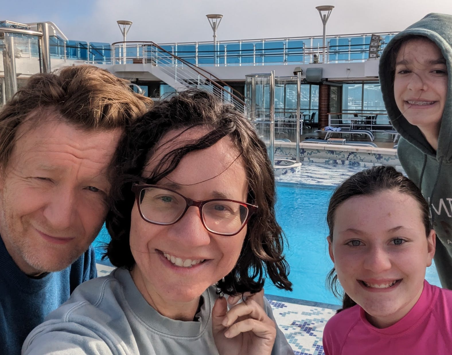 The writer, her husband, and her nieces swimming in the morning on a cruise ship.