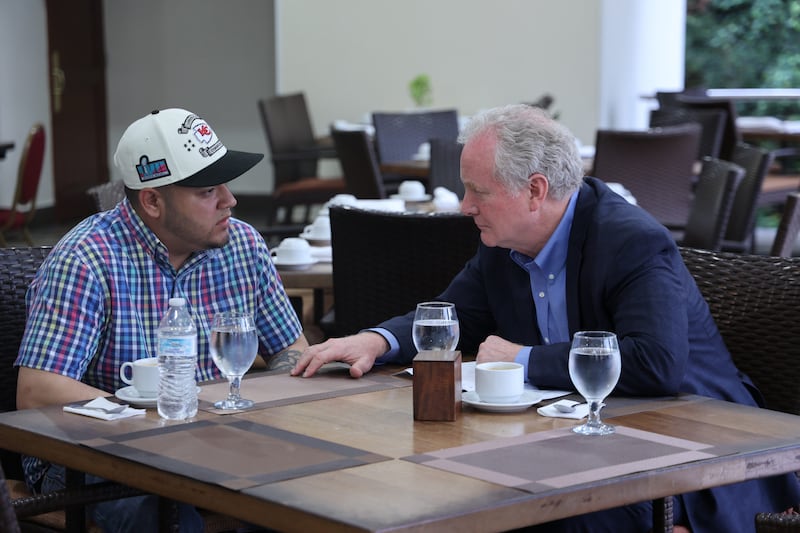 U.S. Sen. Chris Van Hollen (D-MD) meets with Kilmar Armando Abrego Garcia (L) at an undisclosed location on April 17, 2025 in San Salvador, El Salvador.