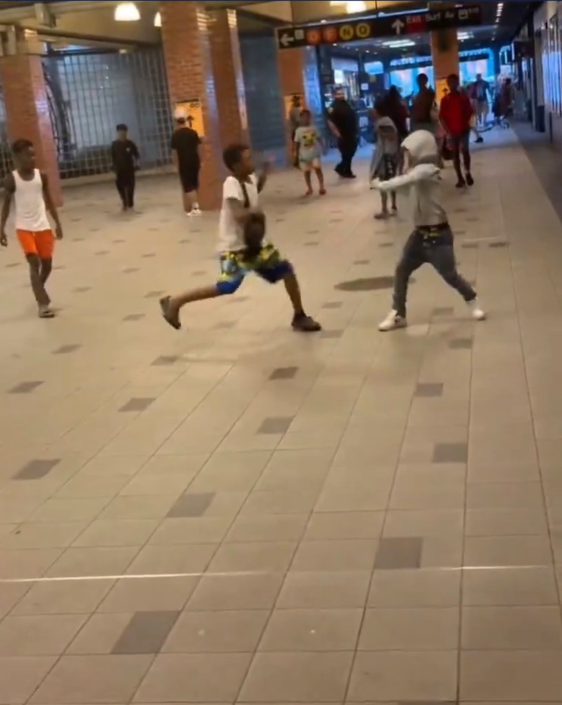 Teen brandishing a knife confronts another teen in a public space.