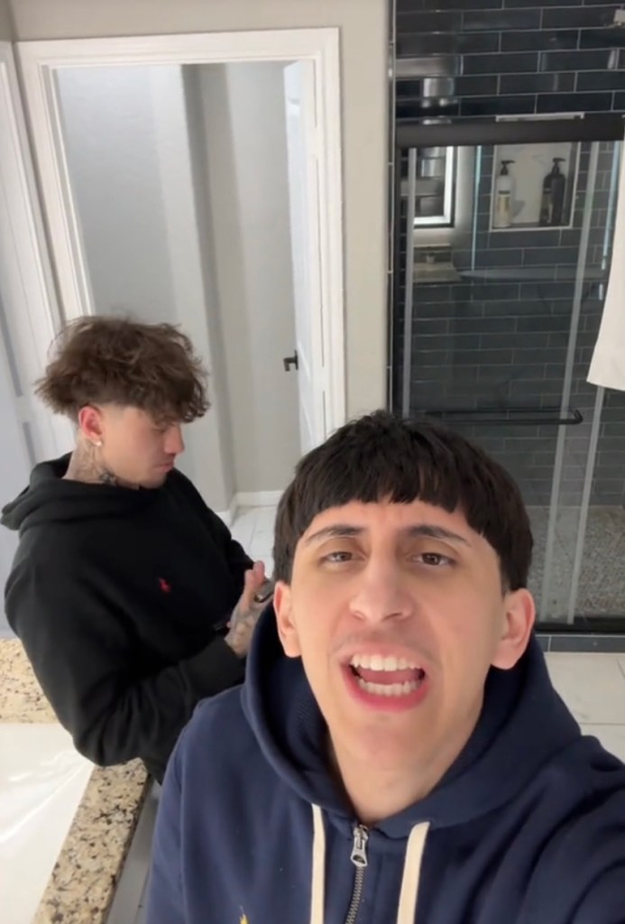 TikTok video of two men in a bathroom.