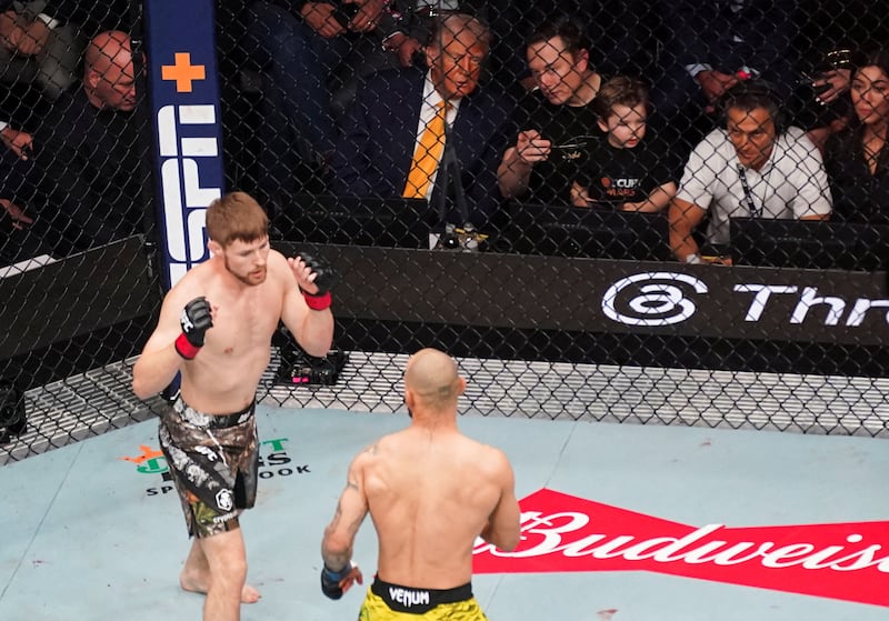 U.S President Donald Trump, Elon Musk and his son, and Dana White, CEO of the Ultimate Fighting Championship, look on during the UFC 314, Bryce Mitchell vs Jean Silva bout at the Kaseya Center, Miami Florida, U.S, April 12, 2025. REUTERS/Nathan Howard       TPX IMAGES OF THE DAY