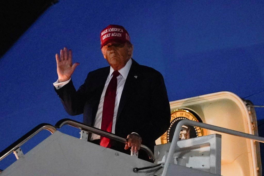 President Donald Trump waves upon arrival at Joint Base Andrews following a visit to Iowa, at Joint Base Andrews, Maryland, U.S. July 4, 2025. 