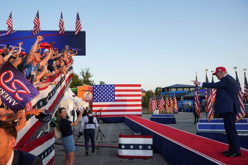 U.S. President Donald Trump gestures as people react on the day he attends an event hosted by America250 in Des Moines, Iowa, U.S., July 3, 2025. REUTERS/Nathan Howard