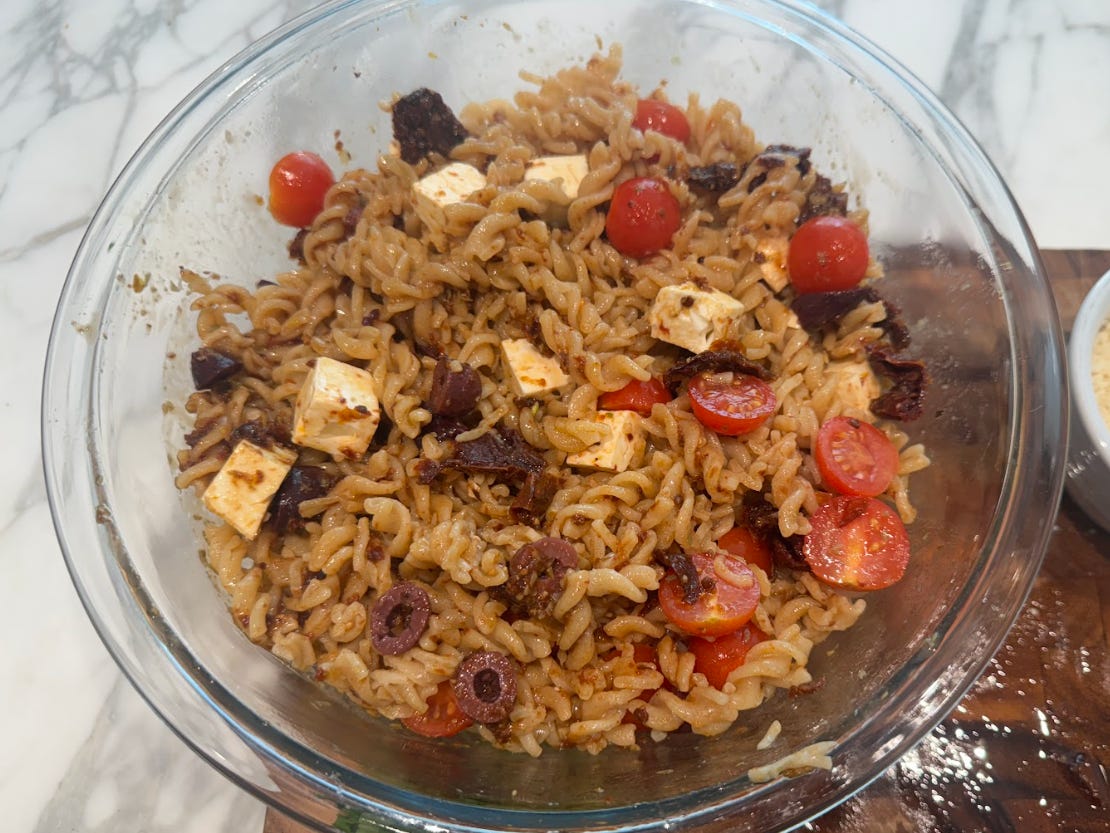 Ina Garten's pasta salad in a bowl on the kitchen table.