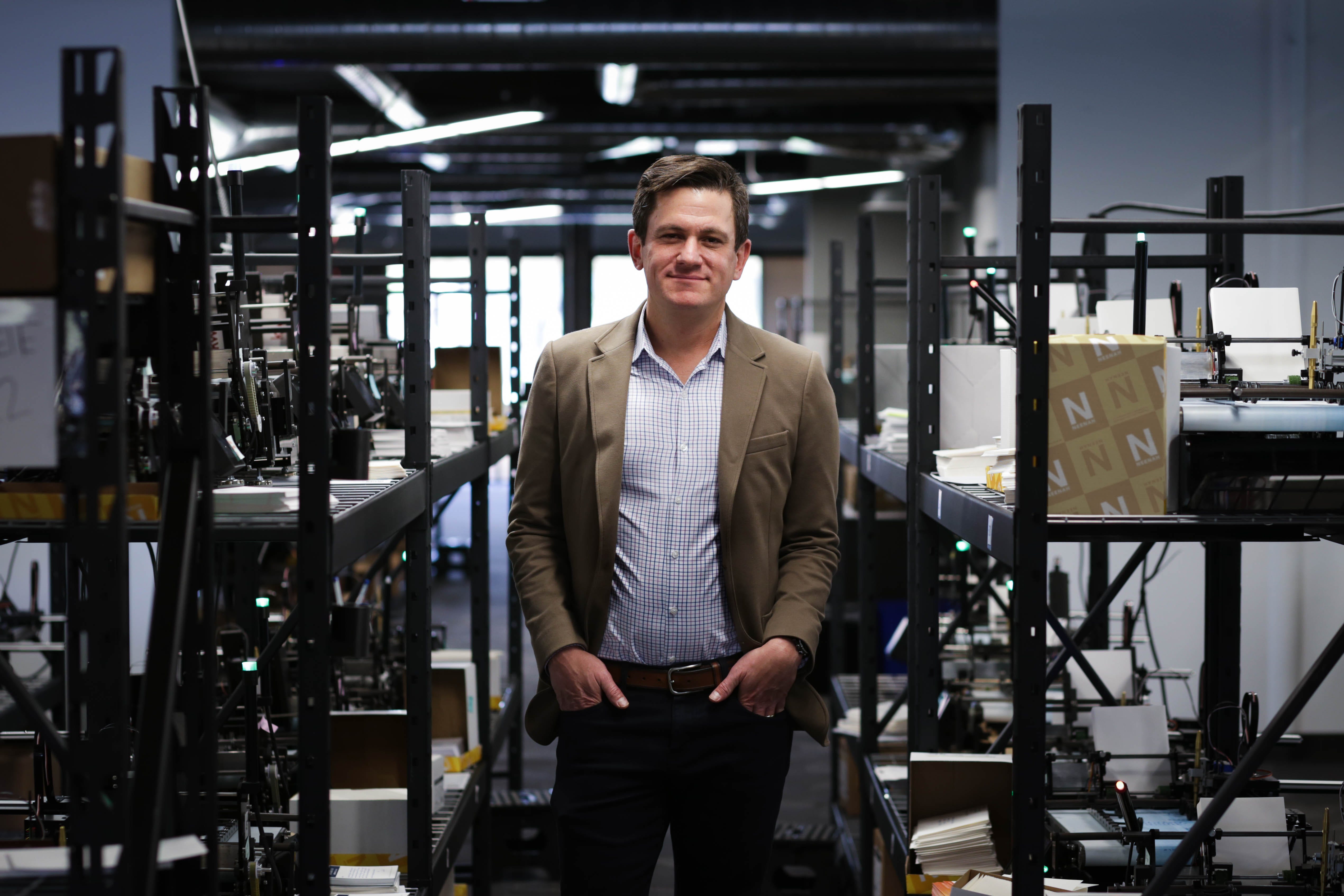 David Wachs, founder and CEO of Handwrytten stands in the company's factory