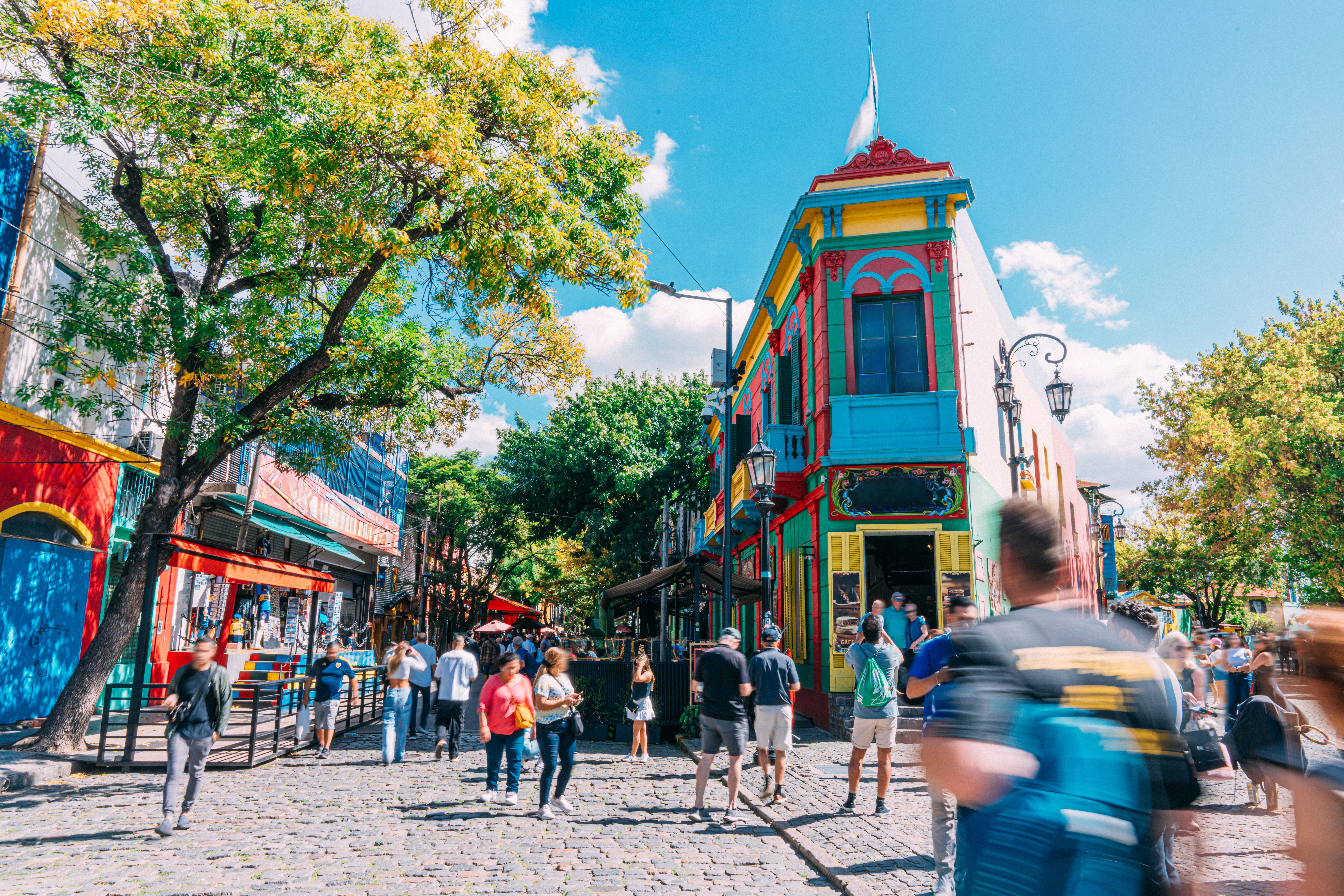 Colorful buildings with people walking on streetsin Argentina