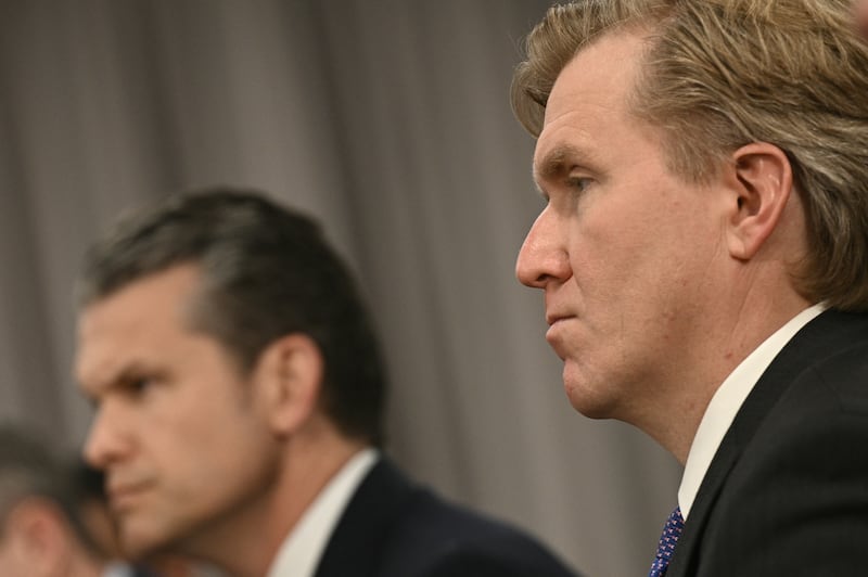 Under Secretary of Defense for Policy Elbridge Colby (R) and US Secretary of Defense Pete Hegseth look on during a meeting at the Pentagon.
