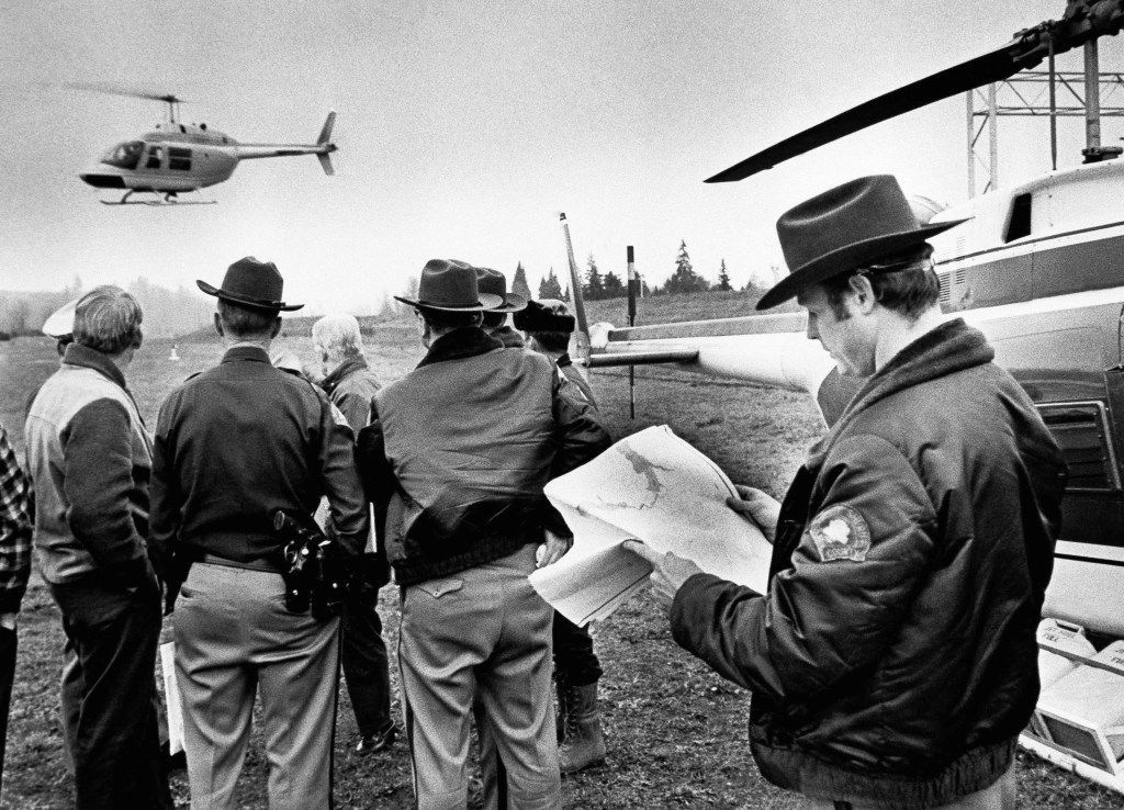 n this undated file photo, a helicopter takes off from search headquarters to scour the area where hijacker Dan Cooper might have parachuted into in Woodland, Wash. 