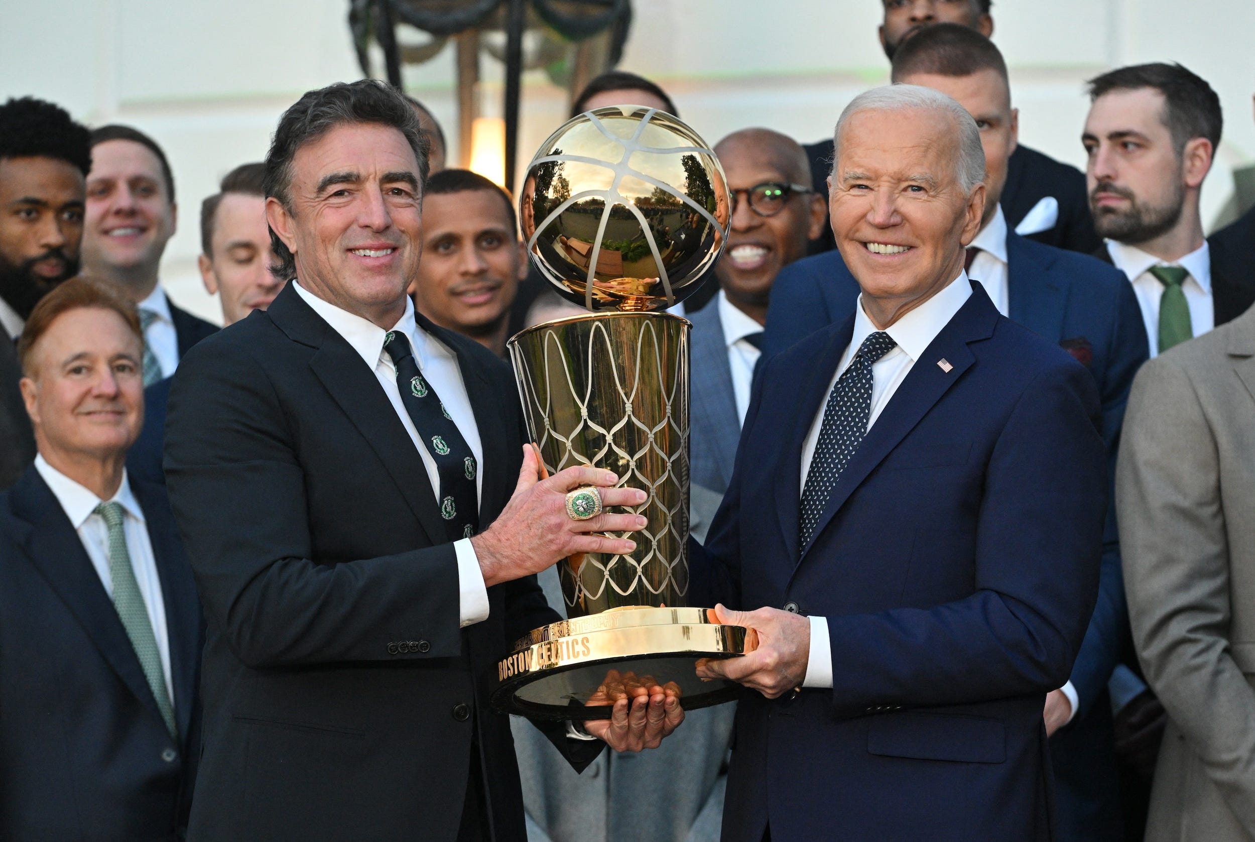 Wyc Grousbeck holds the NBA title alongside President Joe Biden