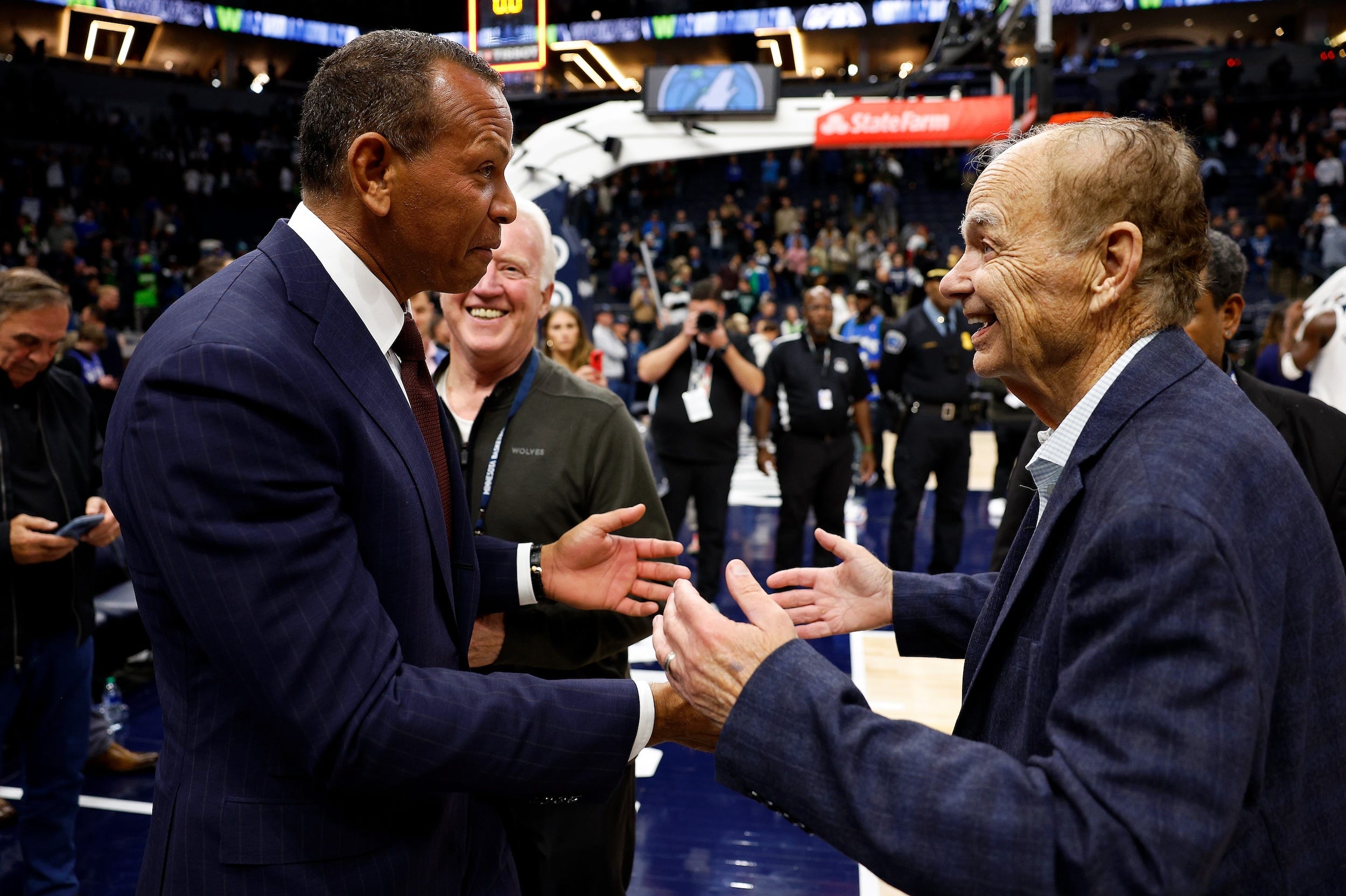 Alex Rodriguez greets Glen Taylor before a 2023 Timberwolves game