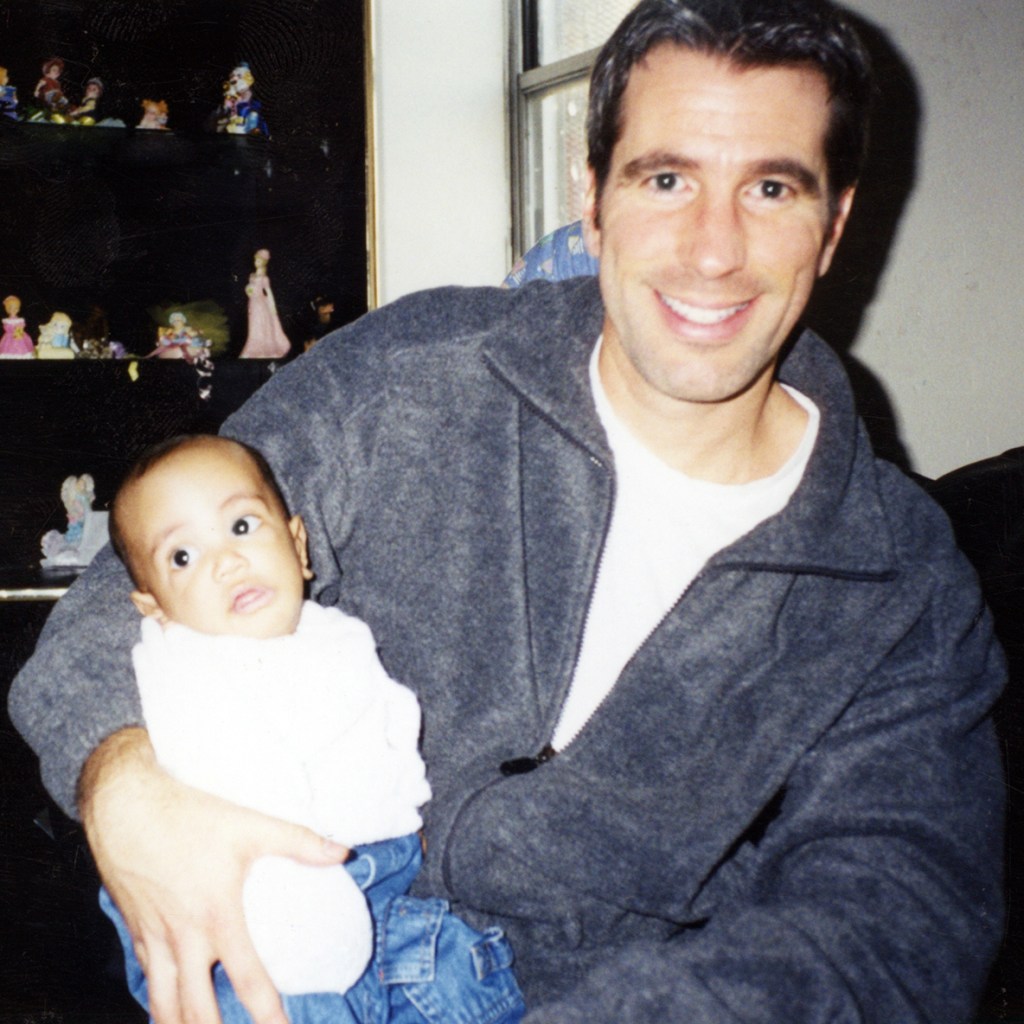 Danny Stewart holding baby.