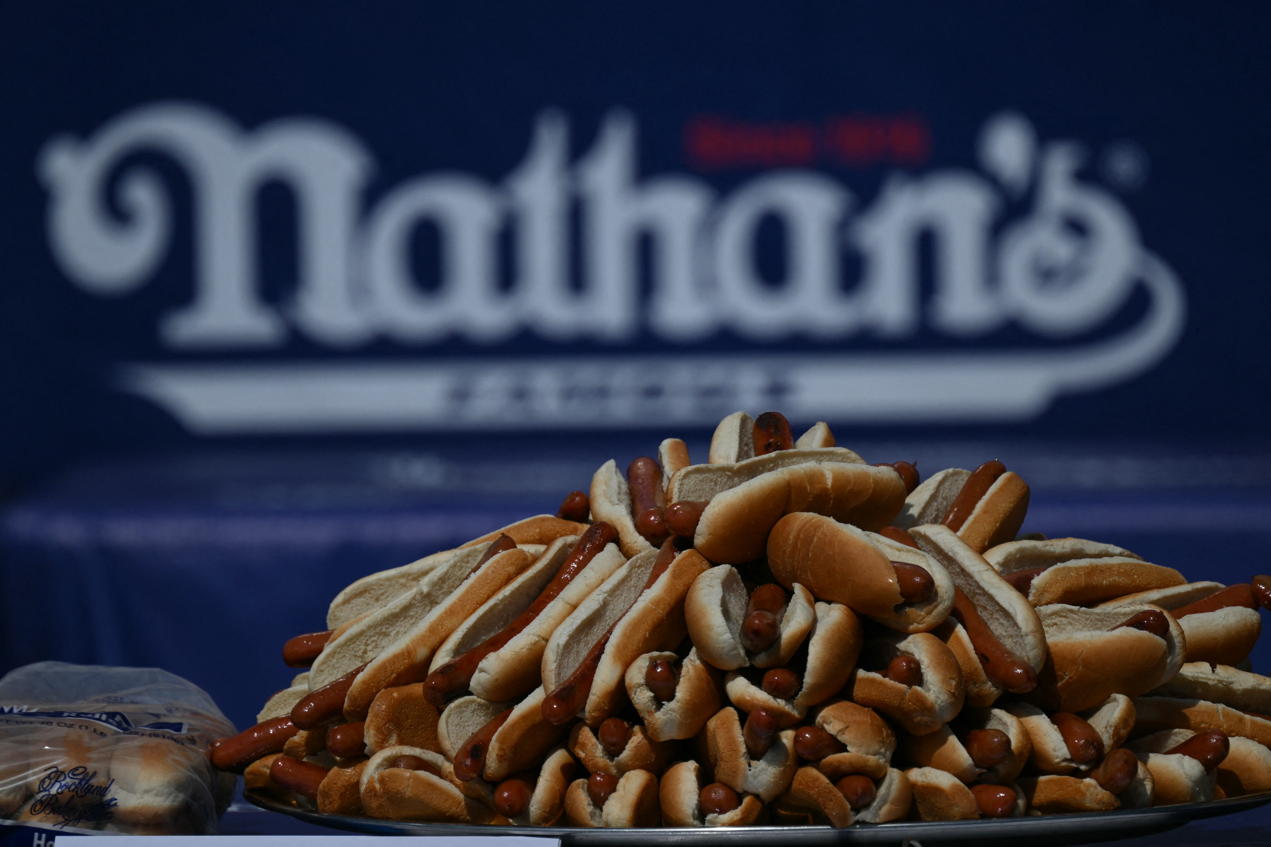 A plate of hot dogs at the Nathatn's Famous Hot Dog Eating Contest