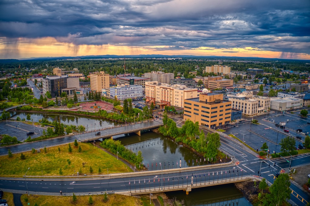 Aerial view of downtown Fairbanks, Alaska at sunset during a storm.