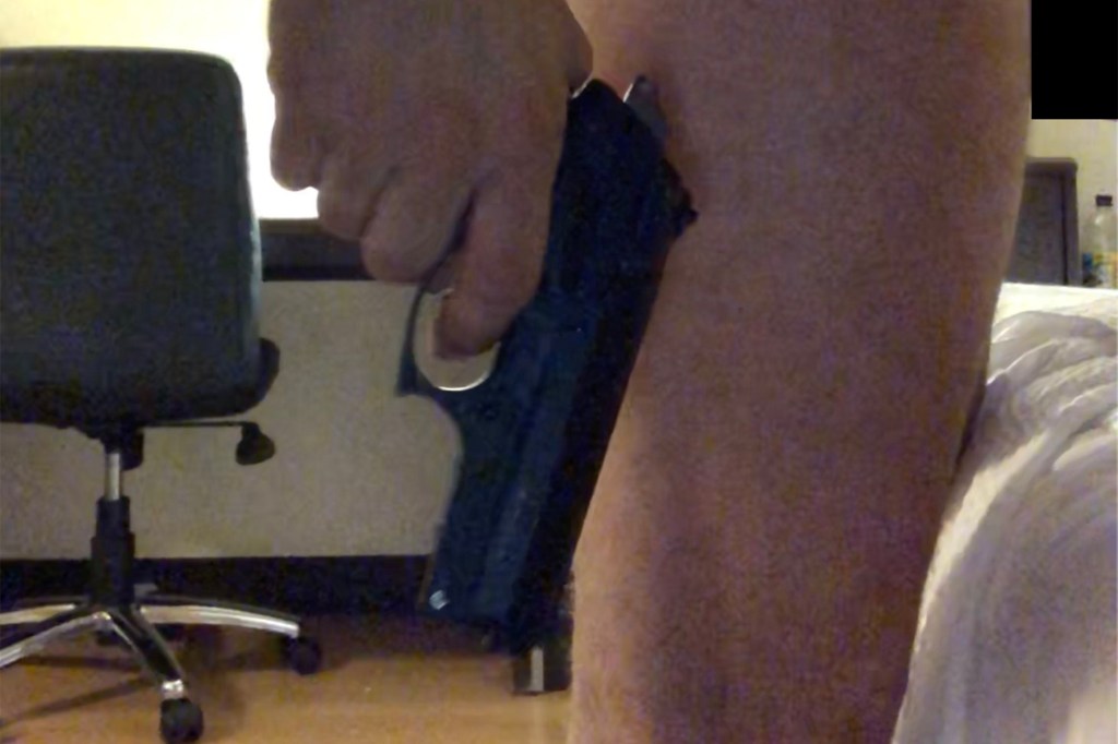 Video grab of a naked Hunter Biden holding a handgun.