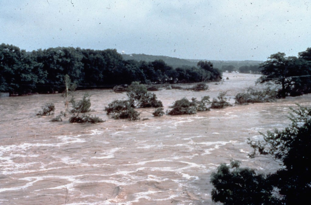 Flooded river with debris.