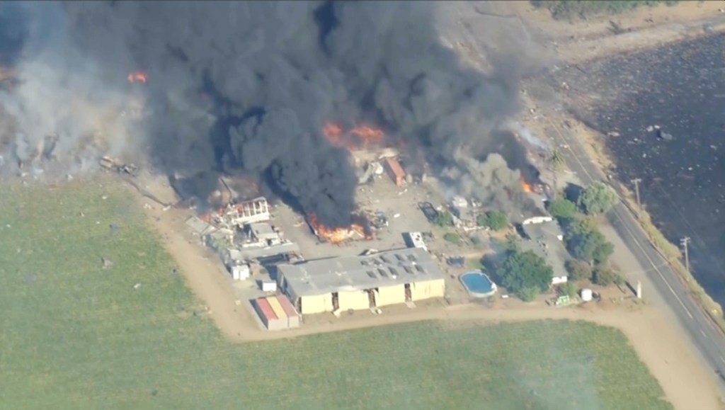 Aerial view of a fireworks warehouse explosion.