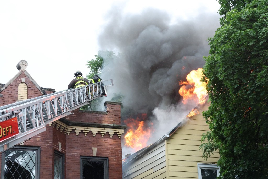 Firefighters battling a house fire.