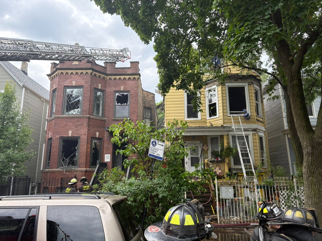Firefighters at the scene of a house fire.
