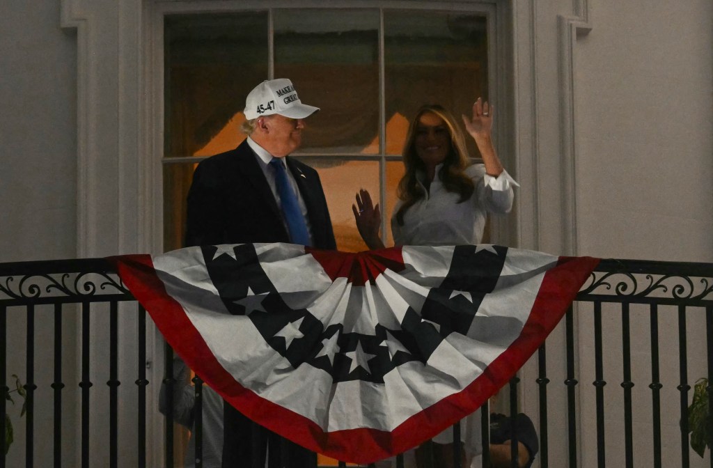 President Donald Trump and first lady Melania Trump dance on the White House Balcony during the Fourth of July Celebration Fireworks in Washington, DC, on July 4, 2025.