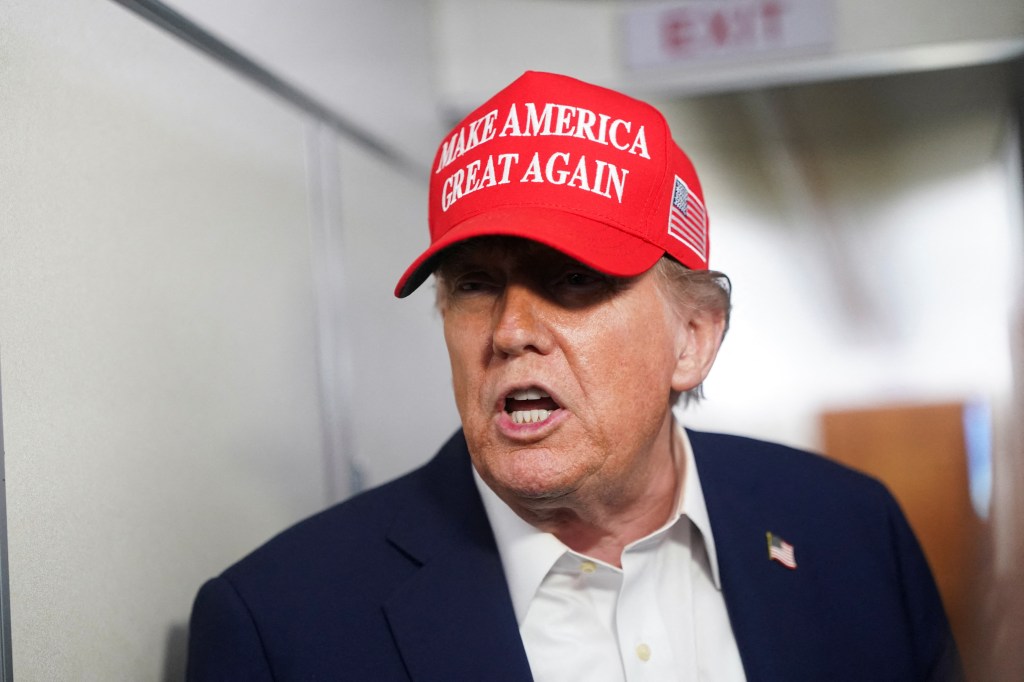 President Donald Trump speaks to reporters aboard Air Force One during a fight to New Jersey on July 4, 2025. 