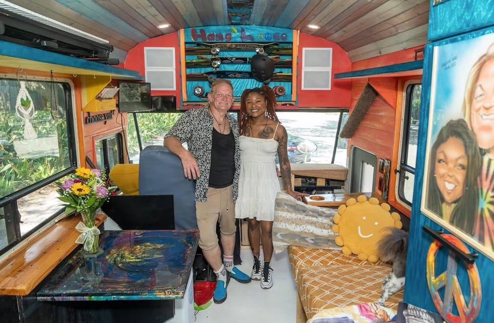 Scott Heltz and Shaquita Riley inside their school bus-turned home
