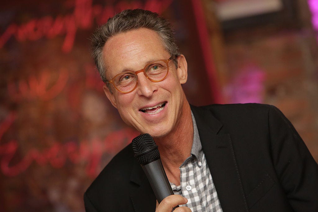 Dr. Mark Hyman speaking into a microphone.