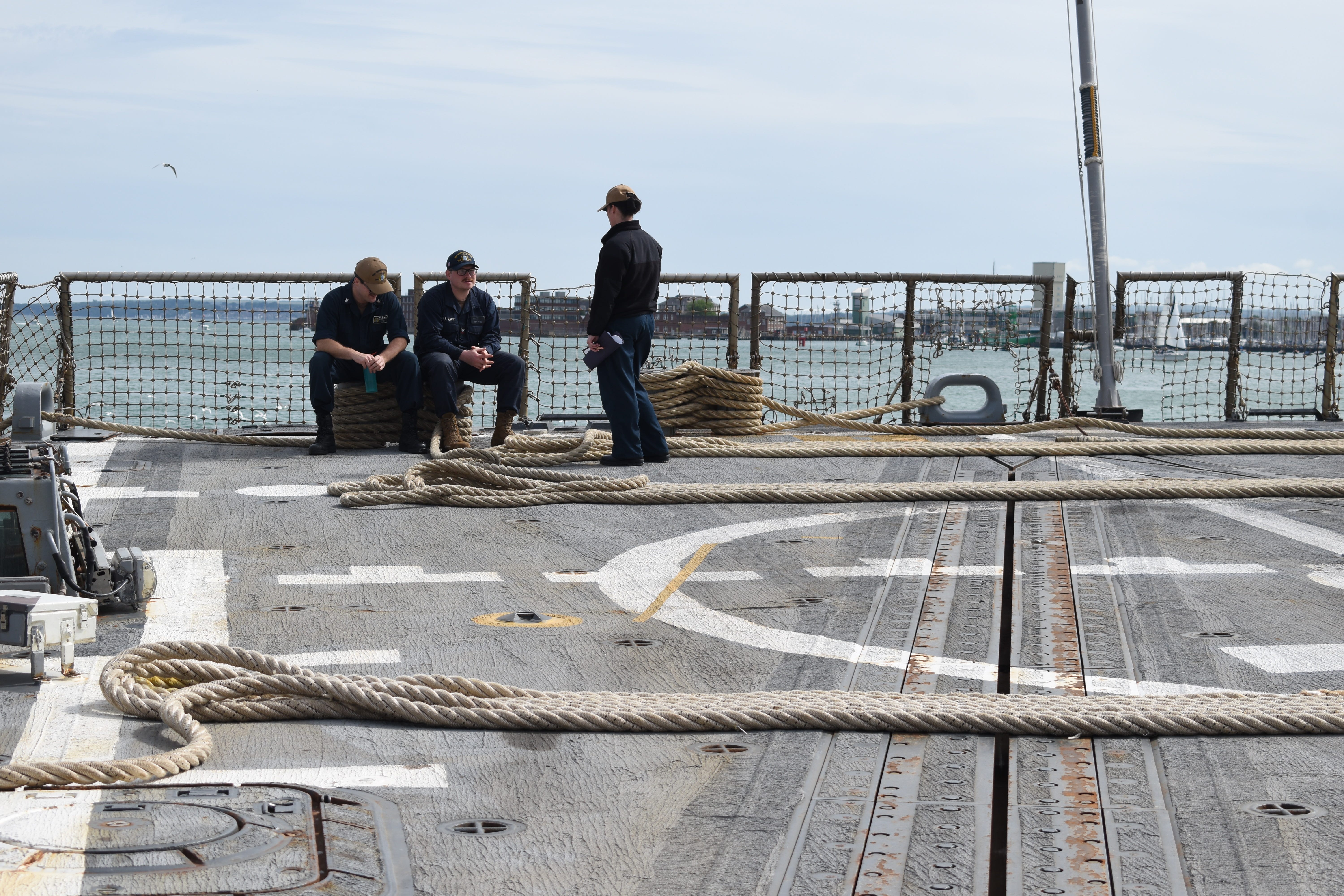Sailors aboard the Navy destroyer USS Thomas Hudner in May 2025.