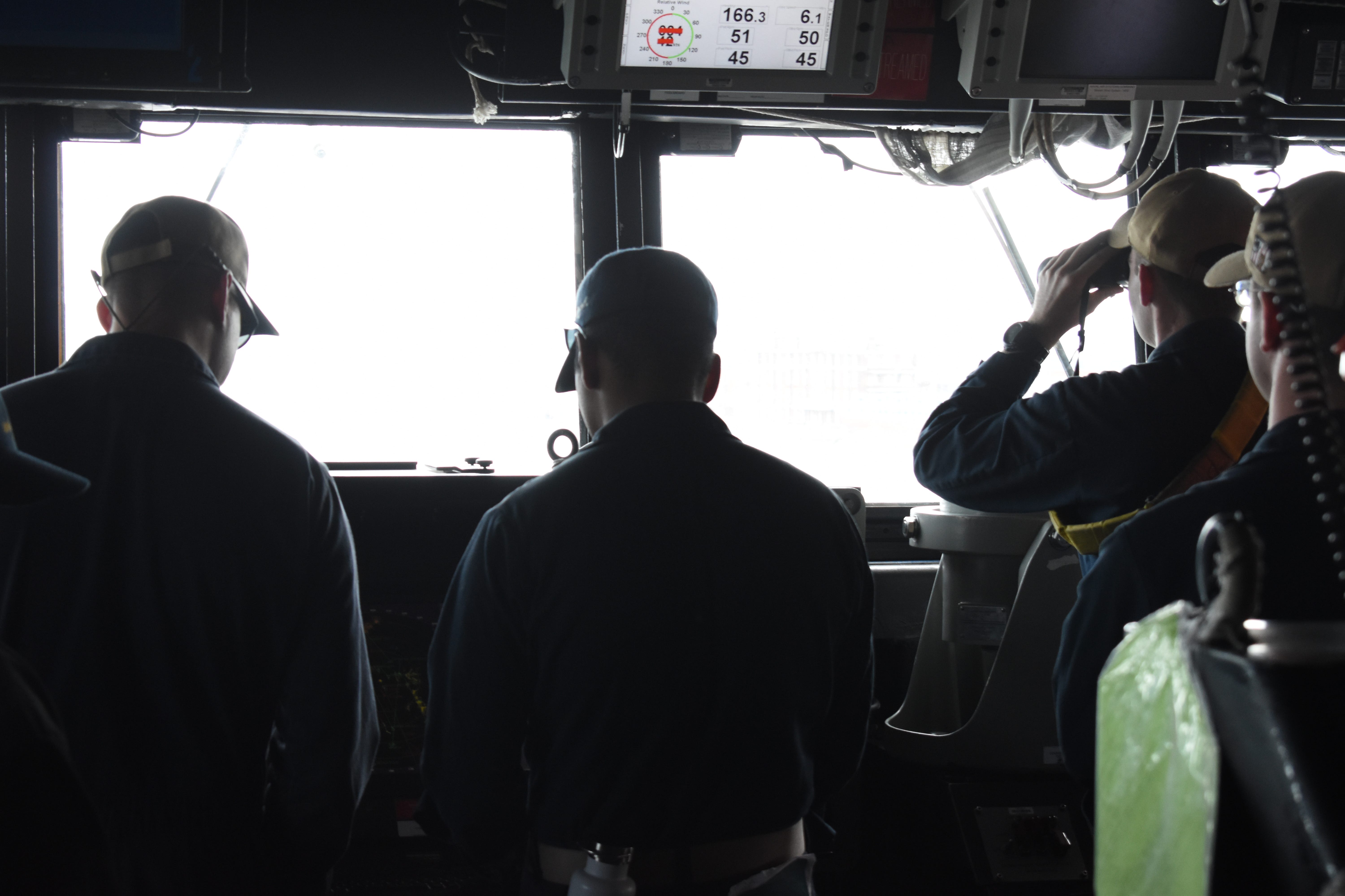 Sailors aboard the Navy destroyer USS Thomas Hudner in May 2025.