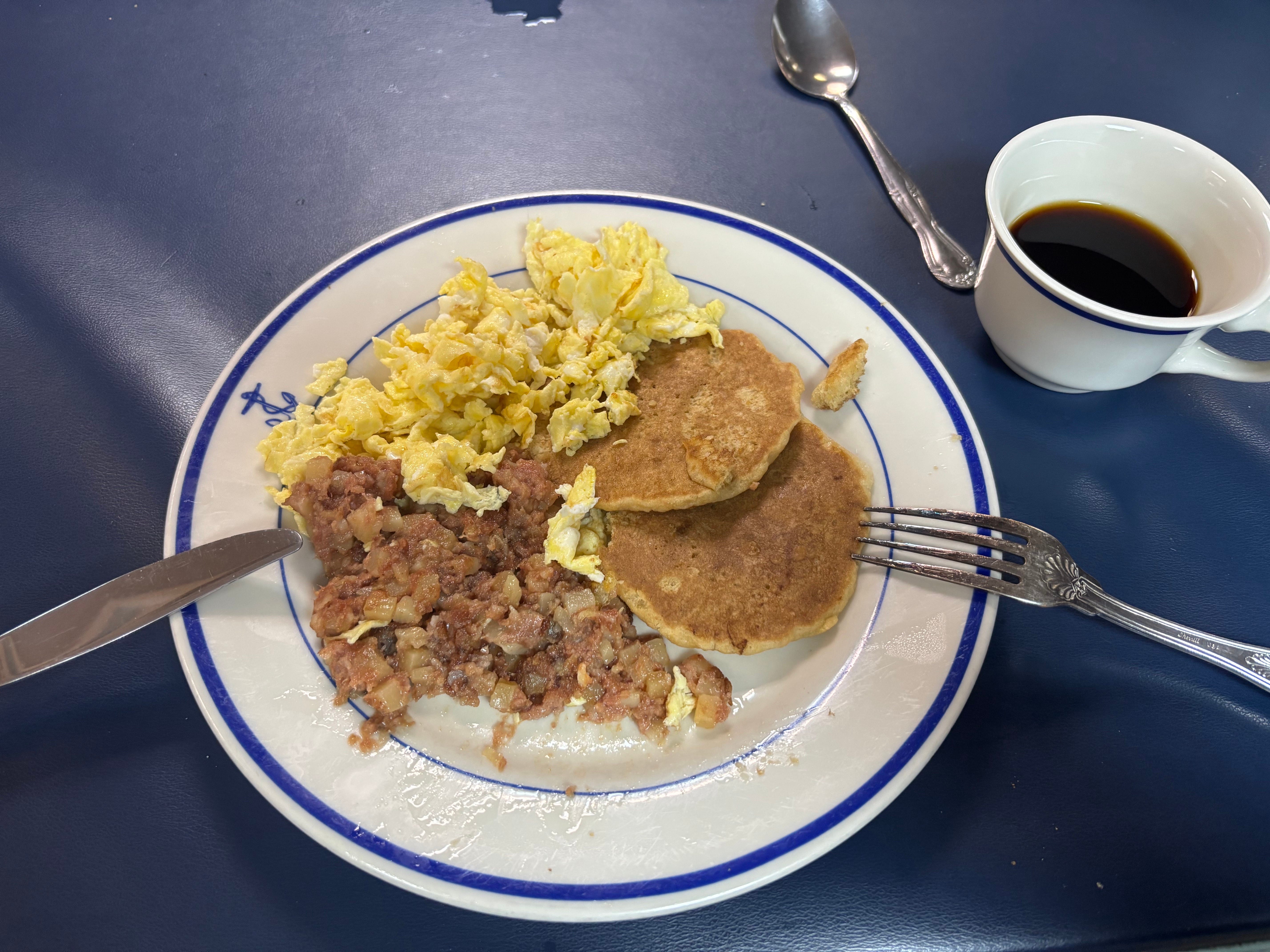 Eggs, pancakes, and corned beef hash on the Navy destroyer USS Thomas Hudner in June 2025.