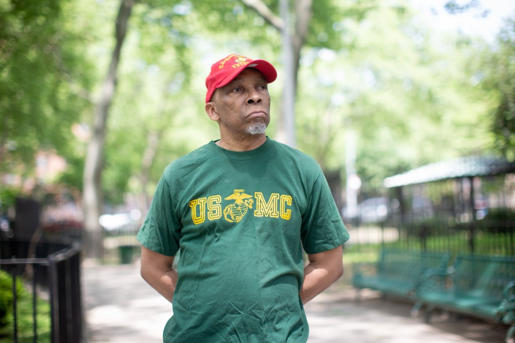 richard corley in a green us mc shirt and red cap