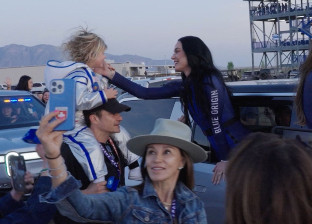 Katy Perry smiling at her daughter Daisy after landing from the Blue Orgin space trip. 