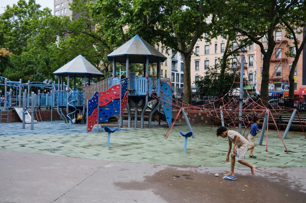 Playground with children playing near a building housing sex offenders.