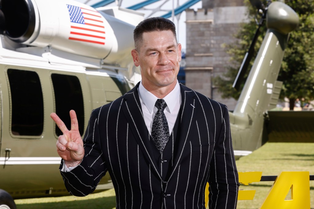 John Cena spreads presidential peace in pinstripes at a photo call for his new action film “Heads of State” in London.