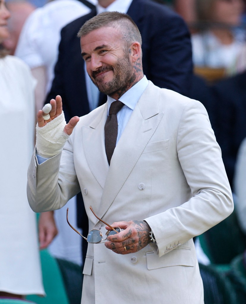 Former UK soccer great David Beckham recovers from recent wrist surgery in the Royal Box at the All England Lawn Tennis Club while taking in the first round of Wimbledon.
