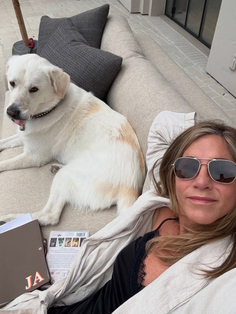 Jennifer Aniston enjoys some quiet time with one of her three dogs, Lord Chesterfield.