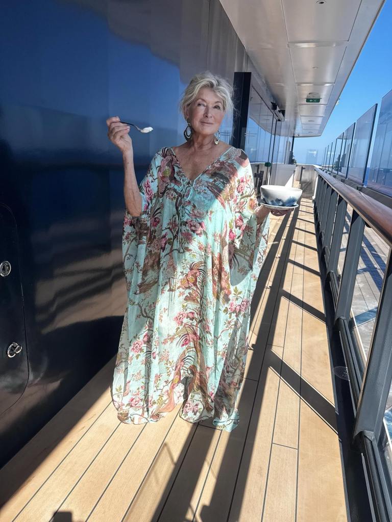 Martha Stewart steps out on deck for a snack in her Roberto Cavalli caftan while on an Italian boating vacation.