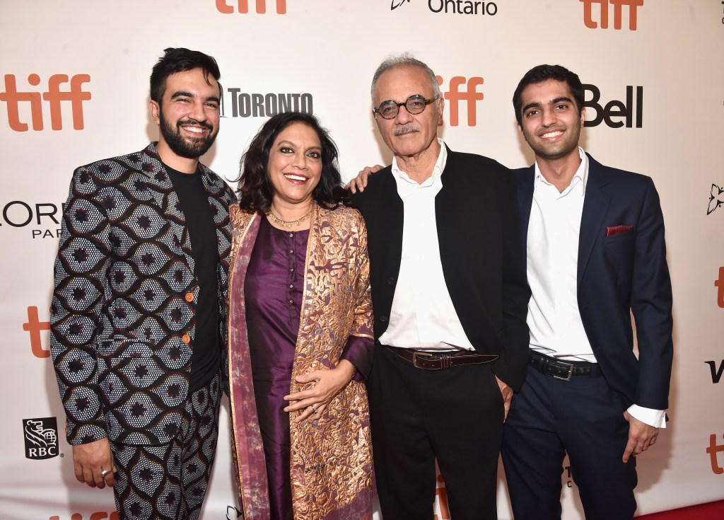 Group photo of mamdani and his parents on the red carpet at the premiere of Disney's 