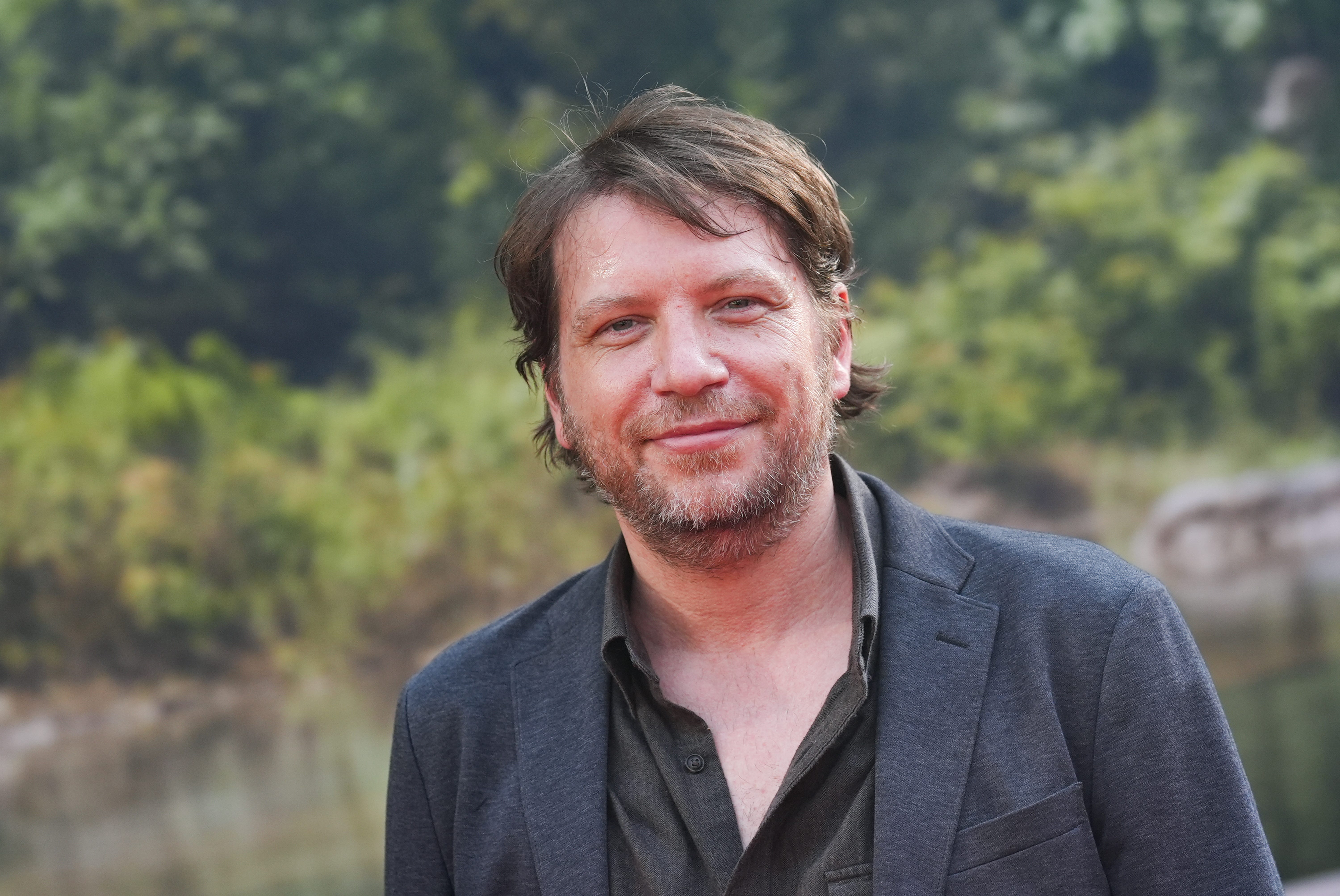 Gareth Edwards in a grey suit