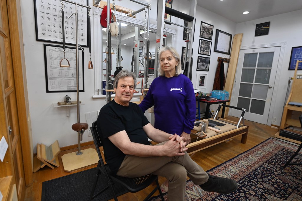 Panos Adamopoulos and wife Sylvia Fuster inside their business Pilates Designs by Sylvia on 31st. St. in Astoria, Queens