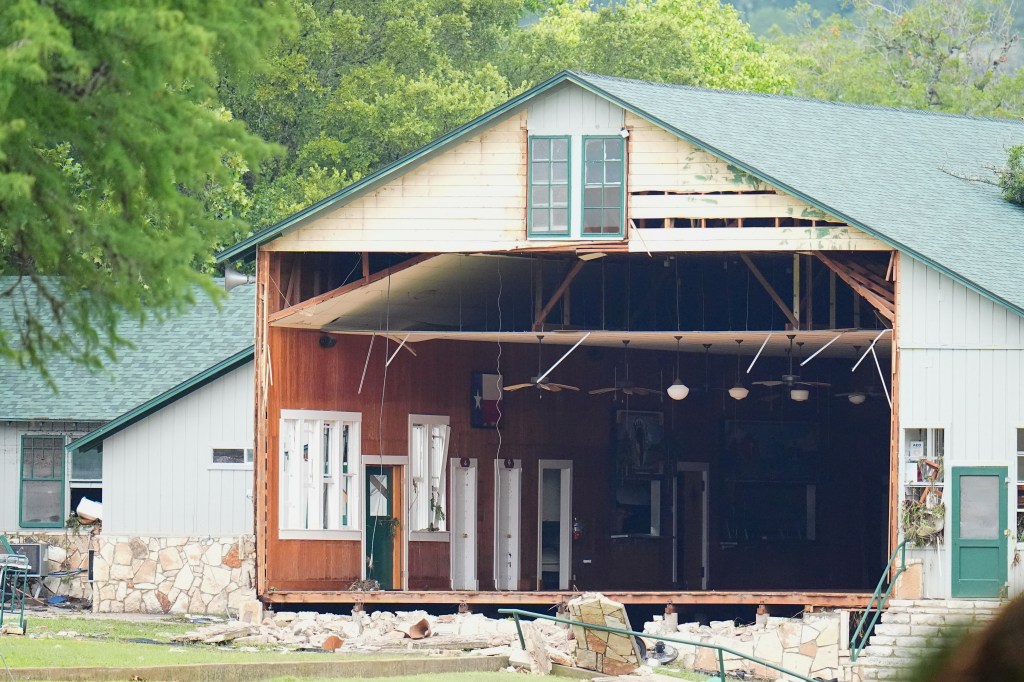 Building with a missing wall after a flash flood.
