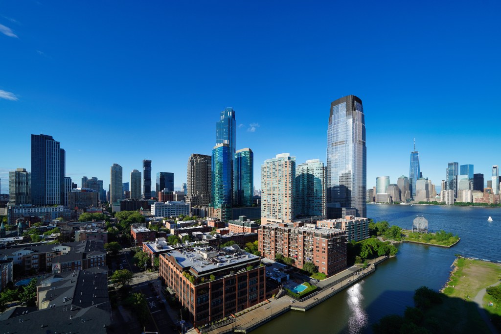 Aerial view of Jersey City and New York City skylines.