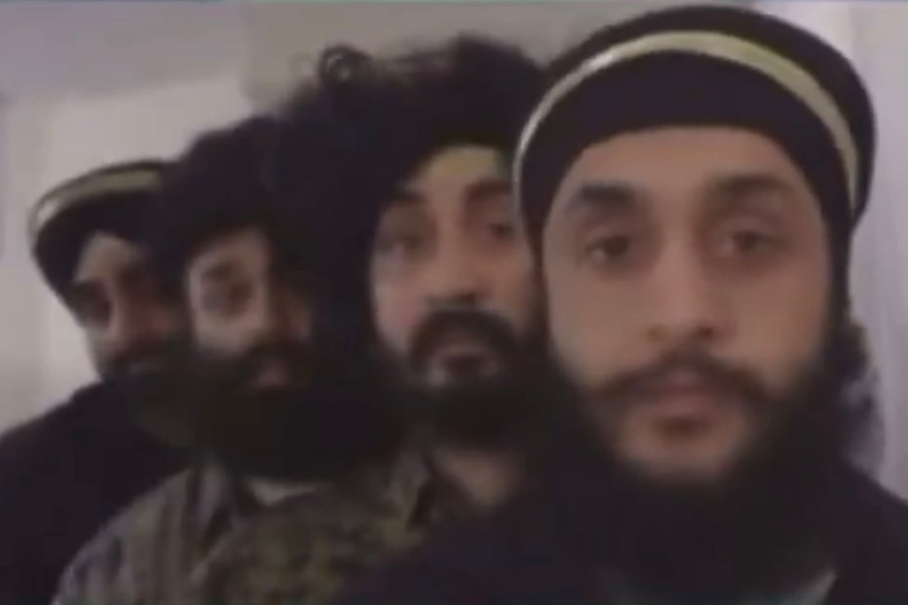 Screenshot of men wearing head coverings.