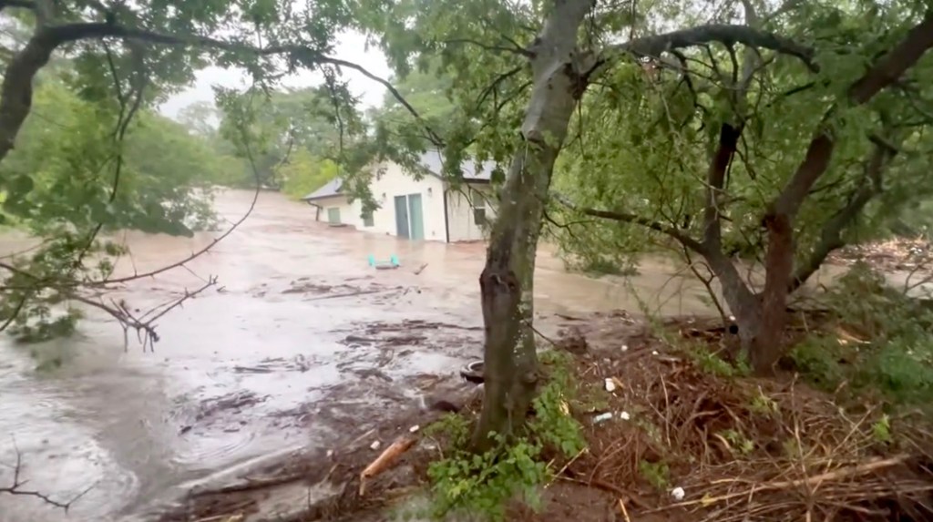 Floodwaters surrounding a house in Center Point, Texas.