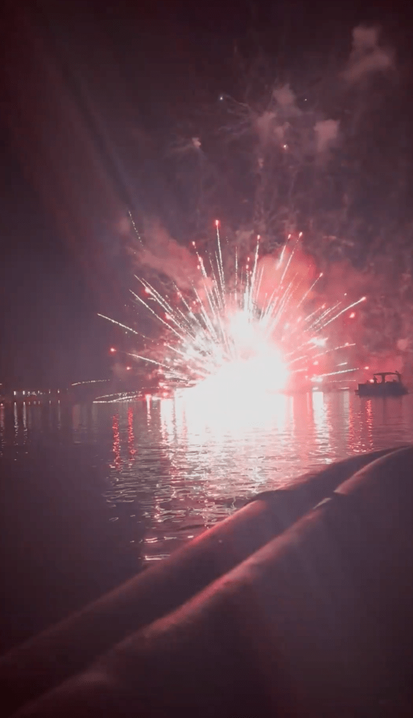 Fireworks over water.