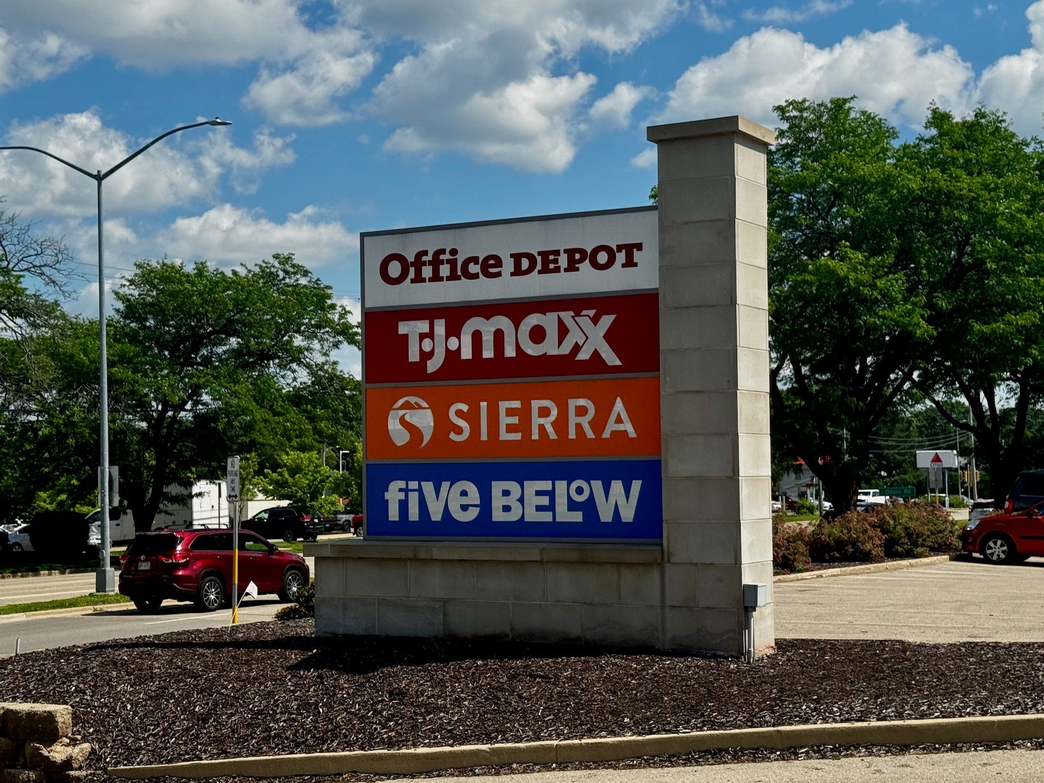 Signs for Office Depot, TJ Maxx, Sierra, and Five Below at a shopping center in Wisconsin.
