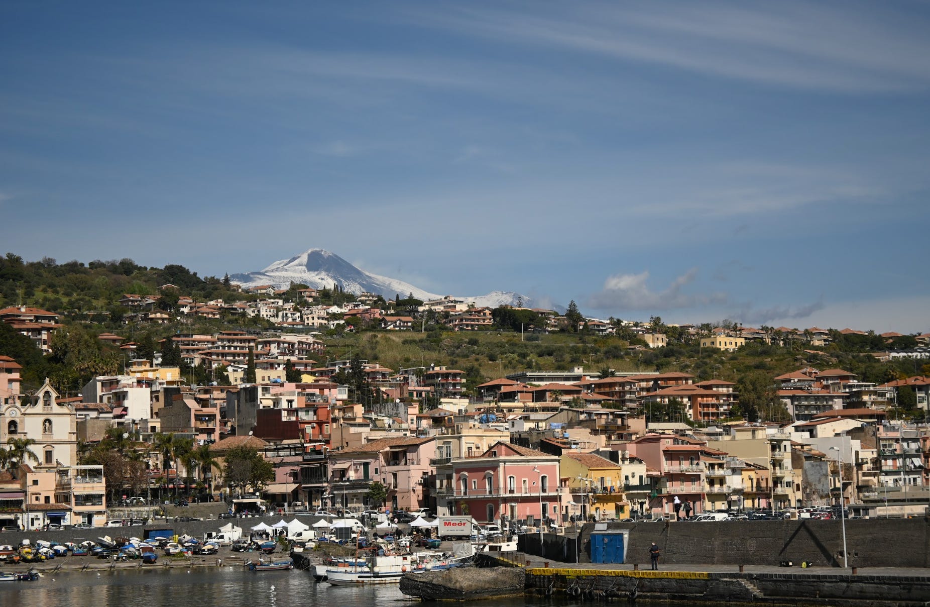 The view of Etna from the marina in Giardini Naxos, Italy.