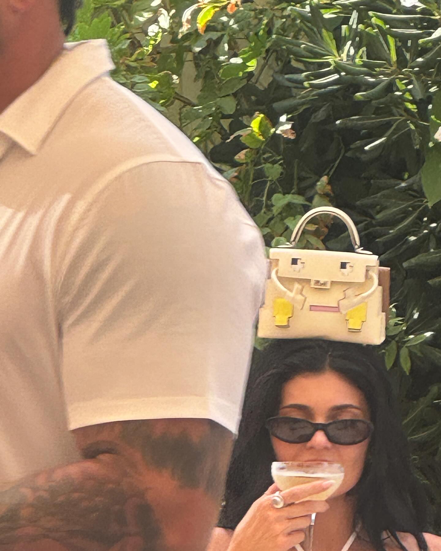 Kylie Jenner with a handbag on her head