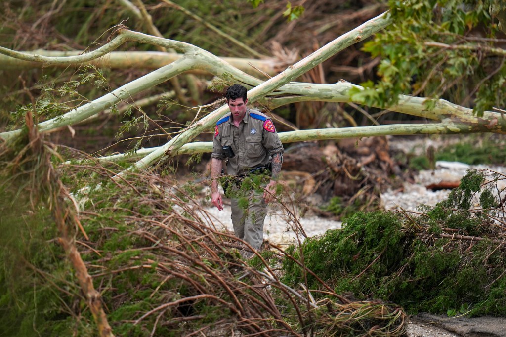 Texas Department of Public Safety official surveying flood damage.