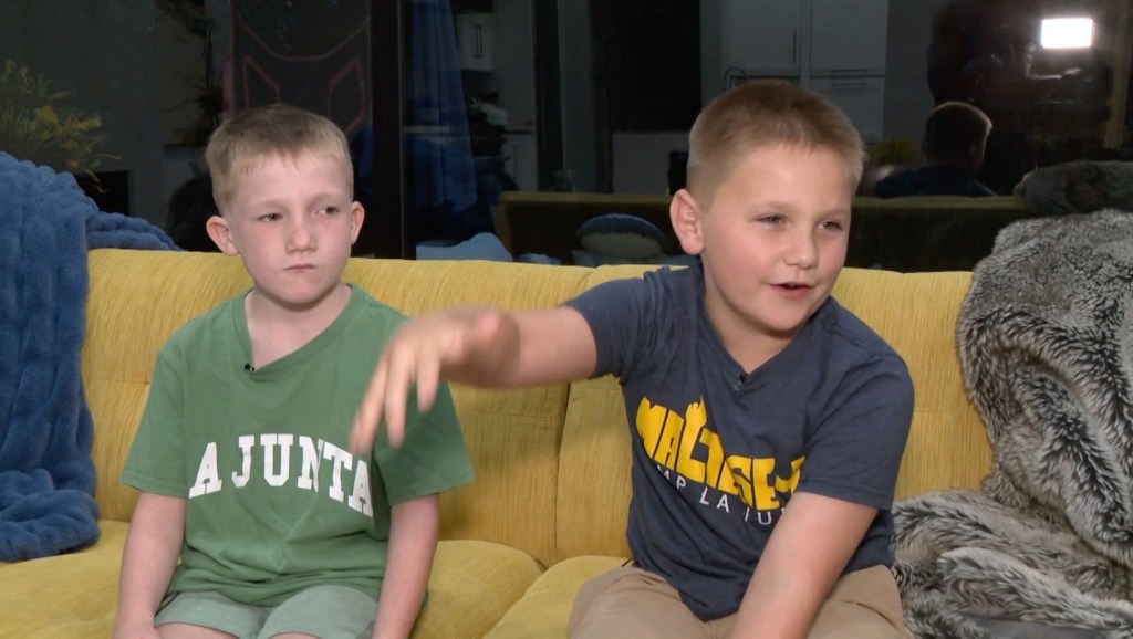 Two brothers being interviewed about flash flooding.